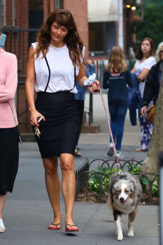 Helena Christensen in Black Skirt walking her dog in New York
