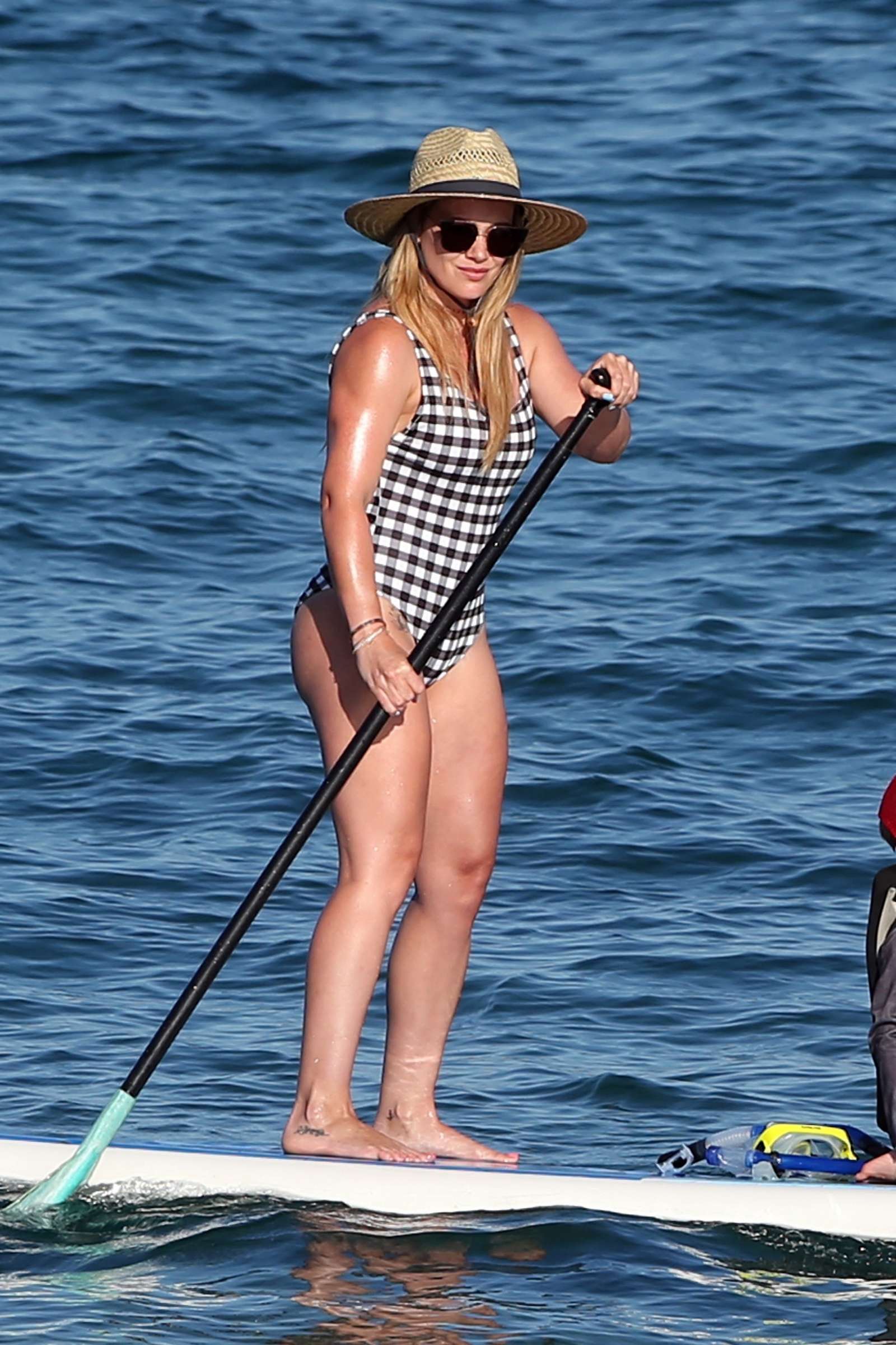 Hilary Duff in Swimsuit on the beach in Hawaii. 