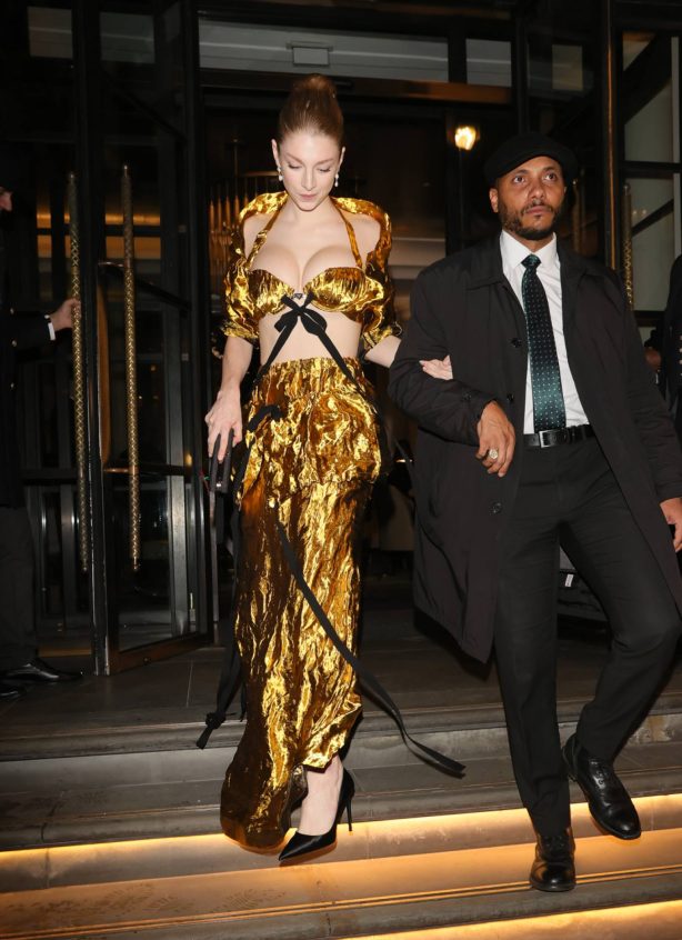 Hunter Schafer - Exits her hotel wearing a gold corset style dress in London