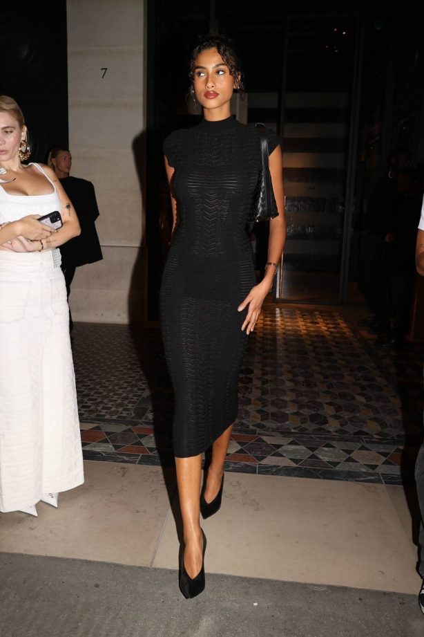 Imaan Hammam - In a black dress during Paris Fashion Week