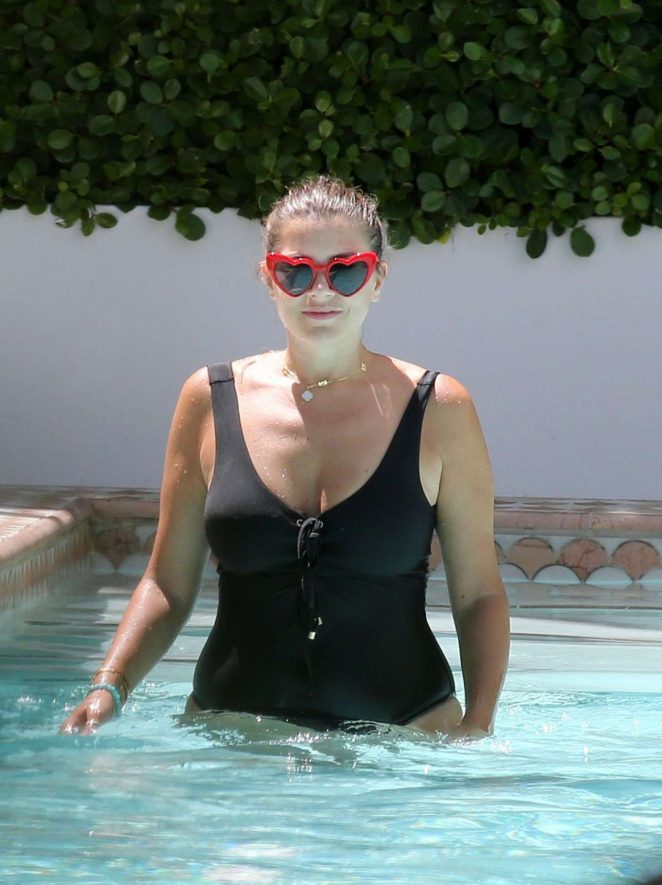 Imogen Thomas in Black Swimsuit on the pool in Miami