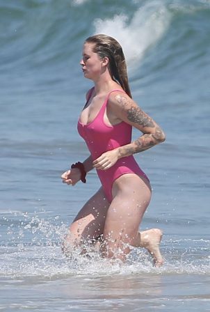 Ireland Baldwin - In Pink Swimsuit at the beach in Malibu