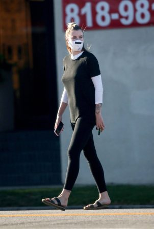 Ireland Baldwin - Wearing mask while run errands in Los Angeles