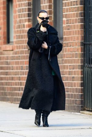 Irina Shayk - In a black big coat with her dog in New York