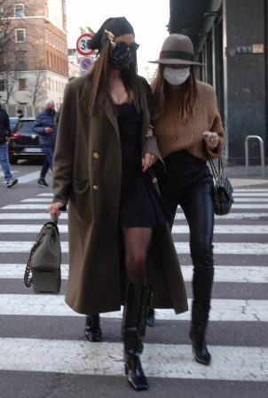 Irina Shayk - In a Versace getup as she walks with her friend Valentina Michetti in Milan