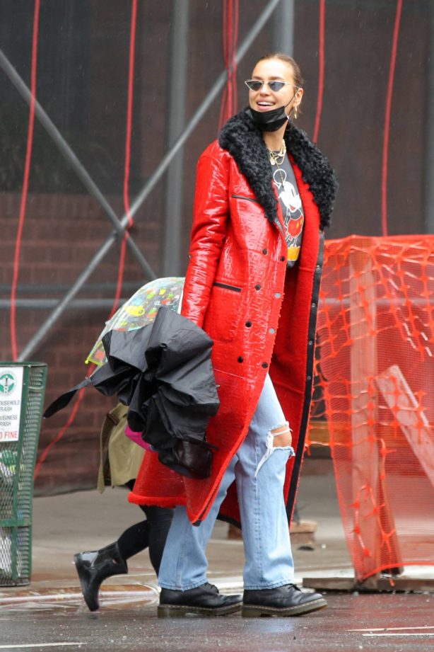 Irina Shayk - In red coat on rainy day in West Village in New York
