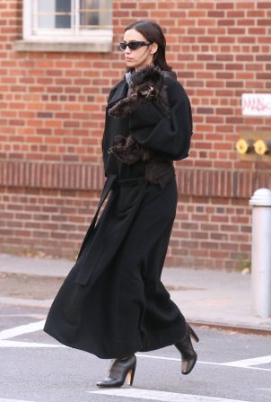 Irina Shayk - Wearing black coat with boots in New York