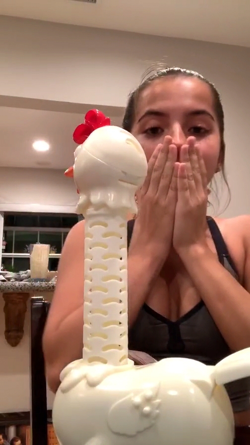 Isabela Moner â€“ Playing with a toy chicken