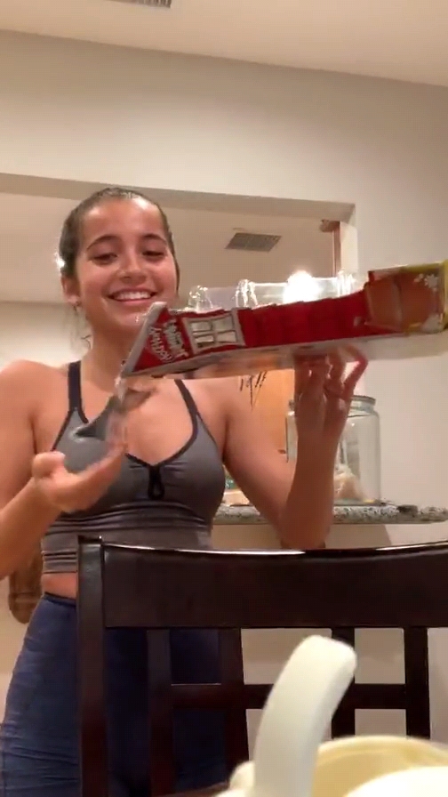Isabela Moner â€“ Playing with a toy chicken