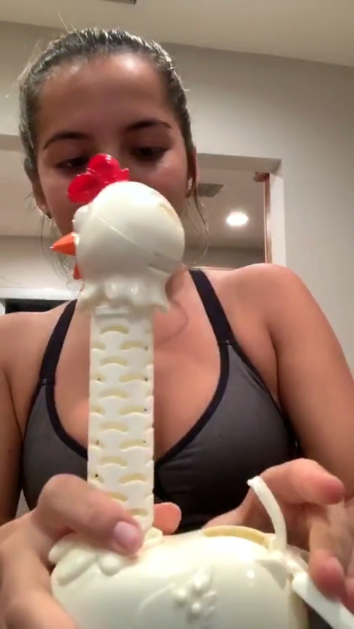 Isabela Moner - Playing with a toy chicken