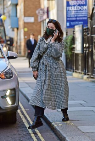 Jenna Coleman - In a monochrome coat on her phone while out in Marylebon