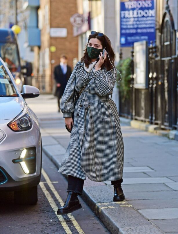 Jenna Coleman - In a monochrome coat on her phone while out in Marylebon