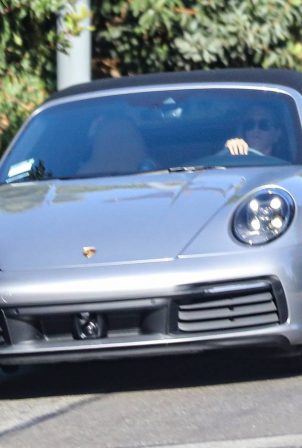Jennifer Aniston - Seen at her Porsche 911 Targa after a pilates class in West Hollywood