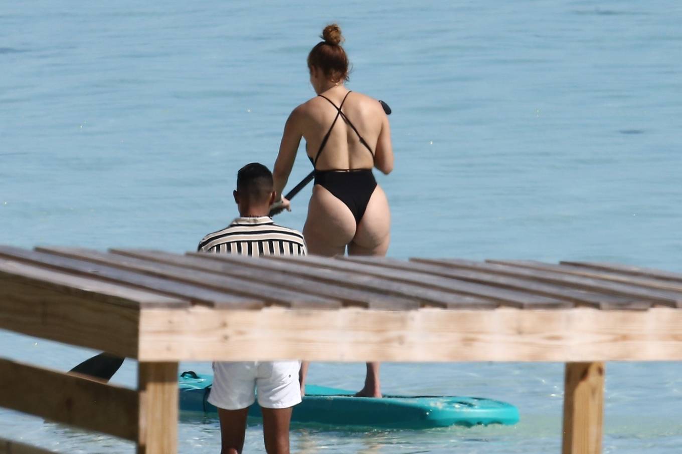 Jennifer Lopez - In a bikini paddle-boarding on the beach in Turks and Caic...