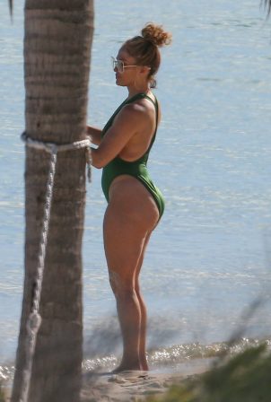 Jennifer Lopez - In a green swimsuit at a beach in Turks and Caicos