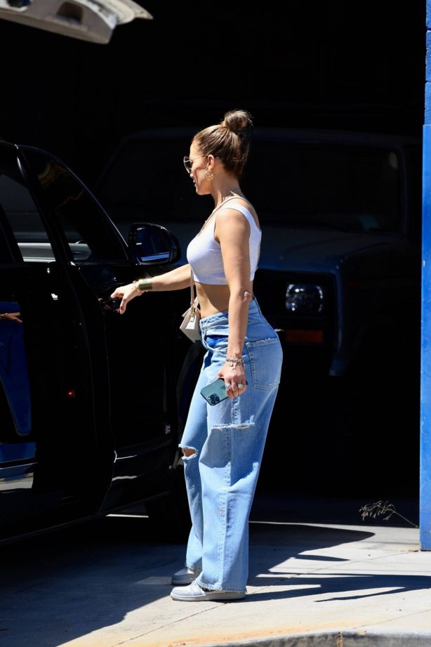 Jennifer Lopez - In baggy denim and a white crop top shopping at Big Daddy's Antiques in LA