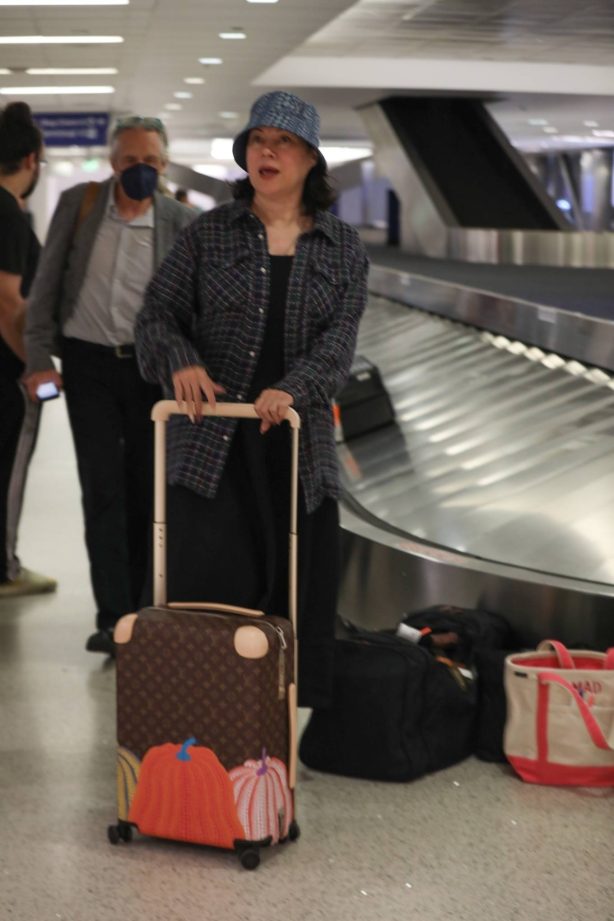 Jennifer Tilly - Waiting for her luggage after her flight into Los Angeles at LAX