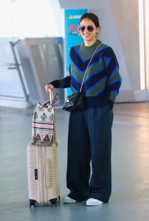 Jessica Alba - With husband Cash Warren arrive to New York's Laguardia Airport