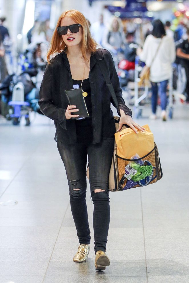 Jessica Chastain in Ripped Jeans at Airport in Montreal
