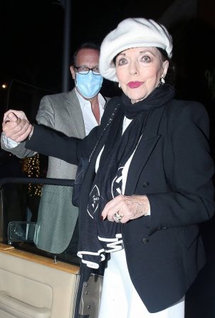 Joan Collins - Out for a dinner with her 56-year old husband Percy Gibson in Los Angeles