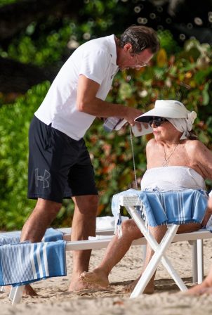 Joan Collins - With her husband Percy Gibson on their holidays in Western Barbados