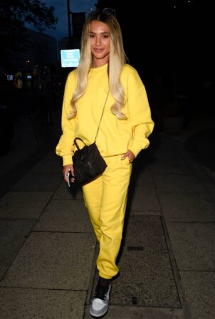Joanna Chimonides - In yellows as she arrives into Manchester Piccadilly