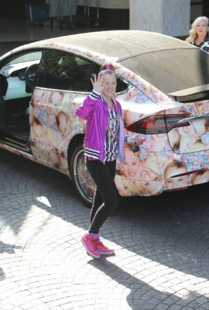 JoJo Siwa - Seen in her Tesla covered with pictures of her face in Los Angeles