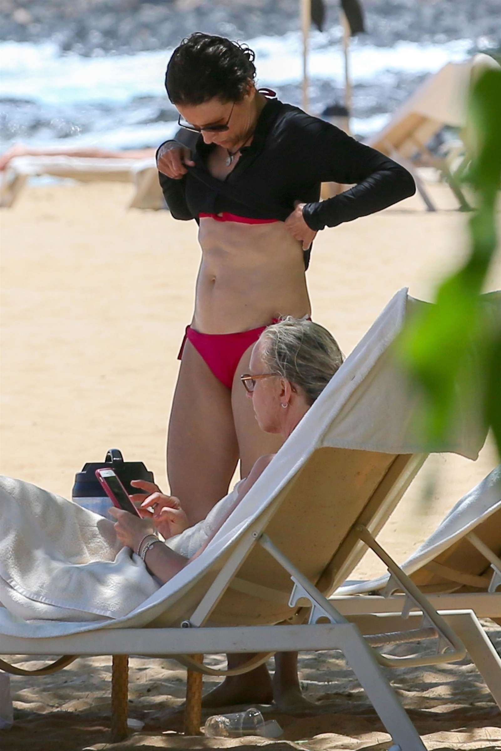Julia Louis-Dreyfus in Red Bikini at the beach on the island of Lanai. 