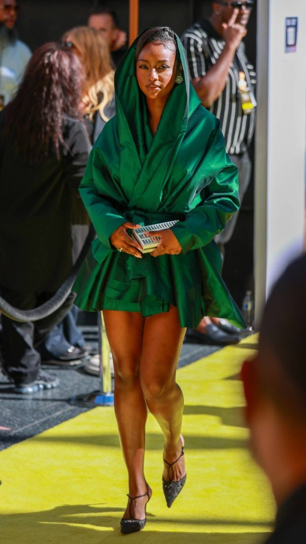 Justine Skye - Pictured in green robe-style coat at iHeart Awards in Hollywood