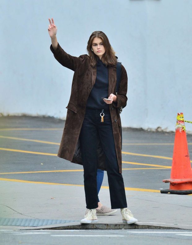 Kaia Gerber waves down a cab in SoHo, NYC