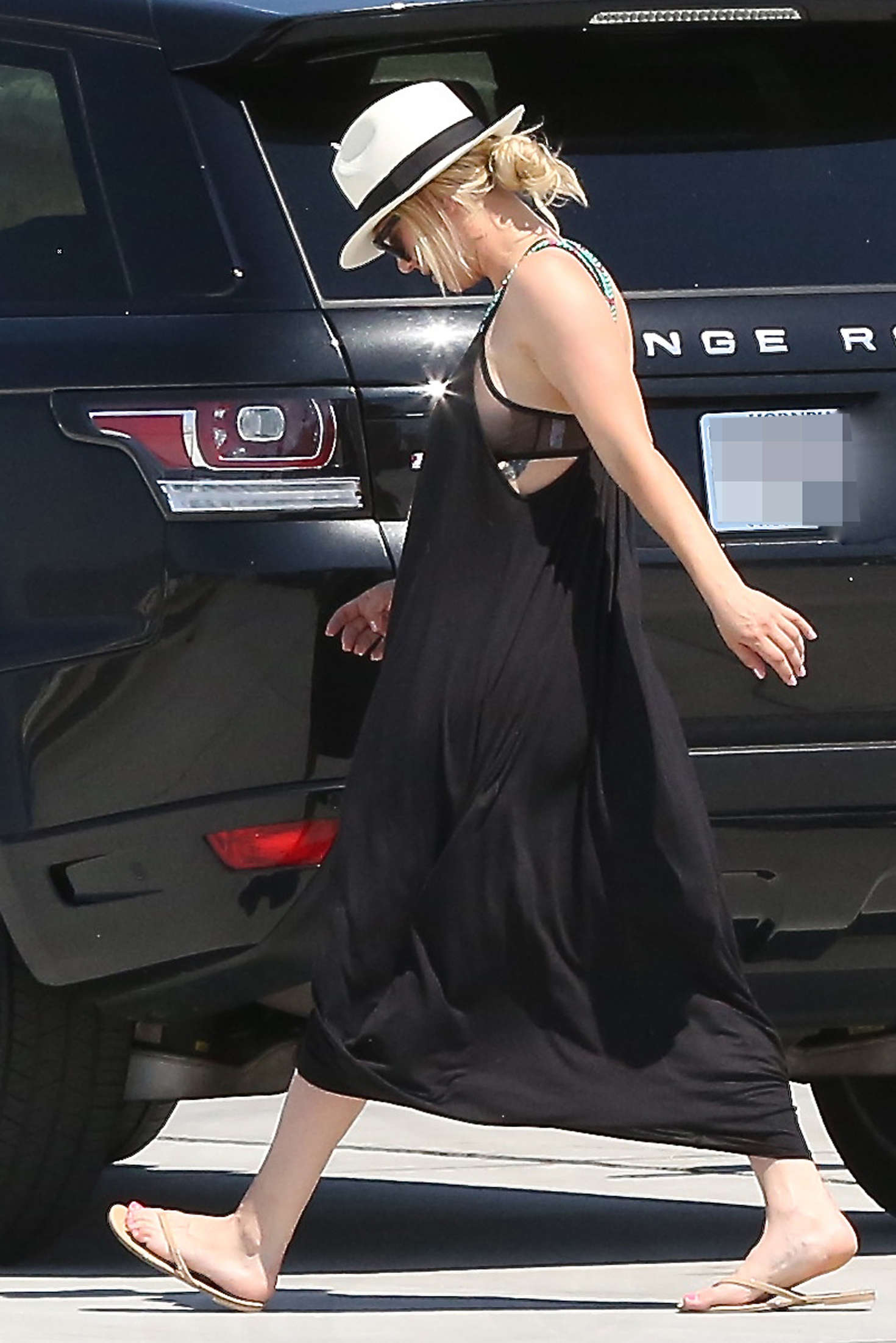 Kaley Cuoco in Black Dress at a private jet in LA. 