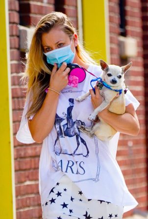 Kaley Cuoco - out with her pup in New York City