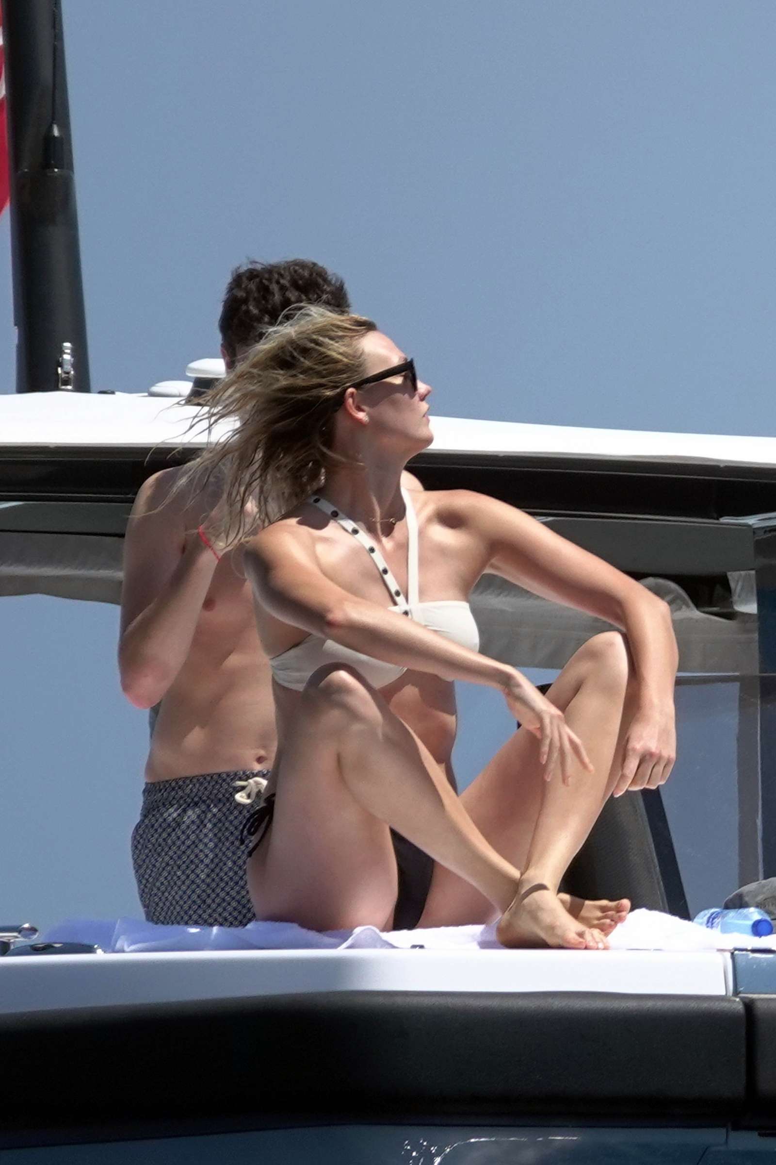Karlie Kloss in White and Black Bikini on holiday in Capri. 