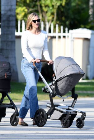 Karlie Kloss - Out for a walk with her baby in Miami