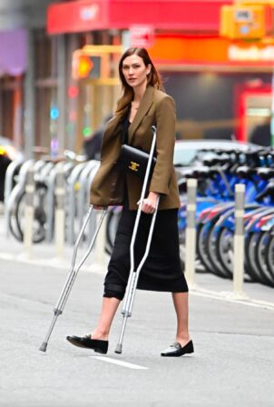 Karlie Kloss - Spotted walking in Soho on Crutches