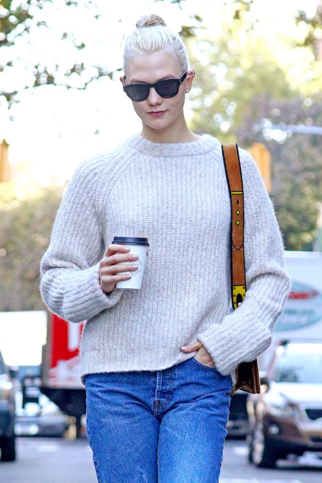 Karlie Kloss wearing a taupe sweater and loose fitting jeans in NYC