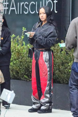 Karrueche Tran - In a baggy Nike track pants with her family at Jon and Vinny's Pizza in LA