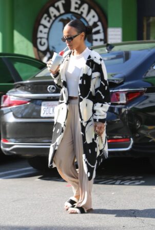 Karrueche Tran - In a white smiley trench coat in West Hollywood
