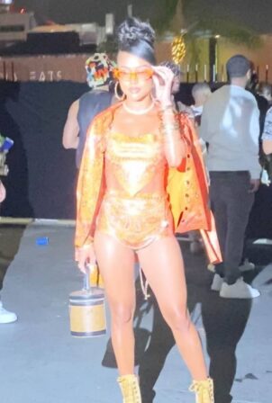 Karrueche Tran -In orange outfit attends Saweetie's 'Freaknik' birthday party in Los Angeles