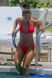 Karrueche Tran in Red Bikini on the pool in Honolulu