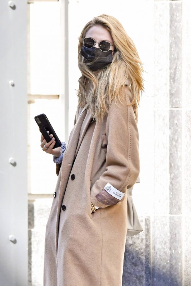 Kate Bock - Wears a Babaton camel colored wool coat in New York