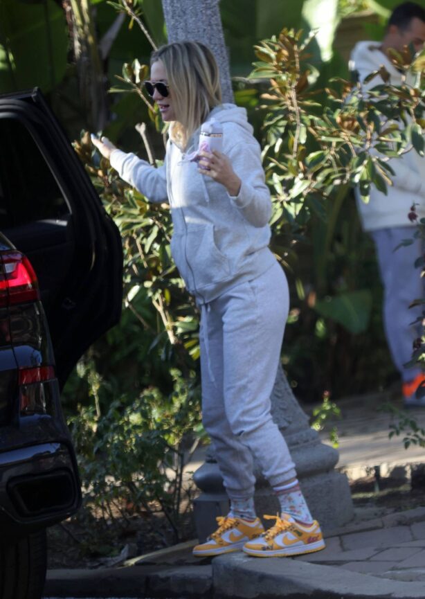 Kate Hudson - Gets playful with her fiance Danny Fujikawa in Los Angeles