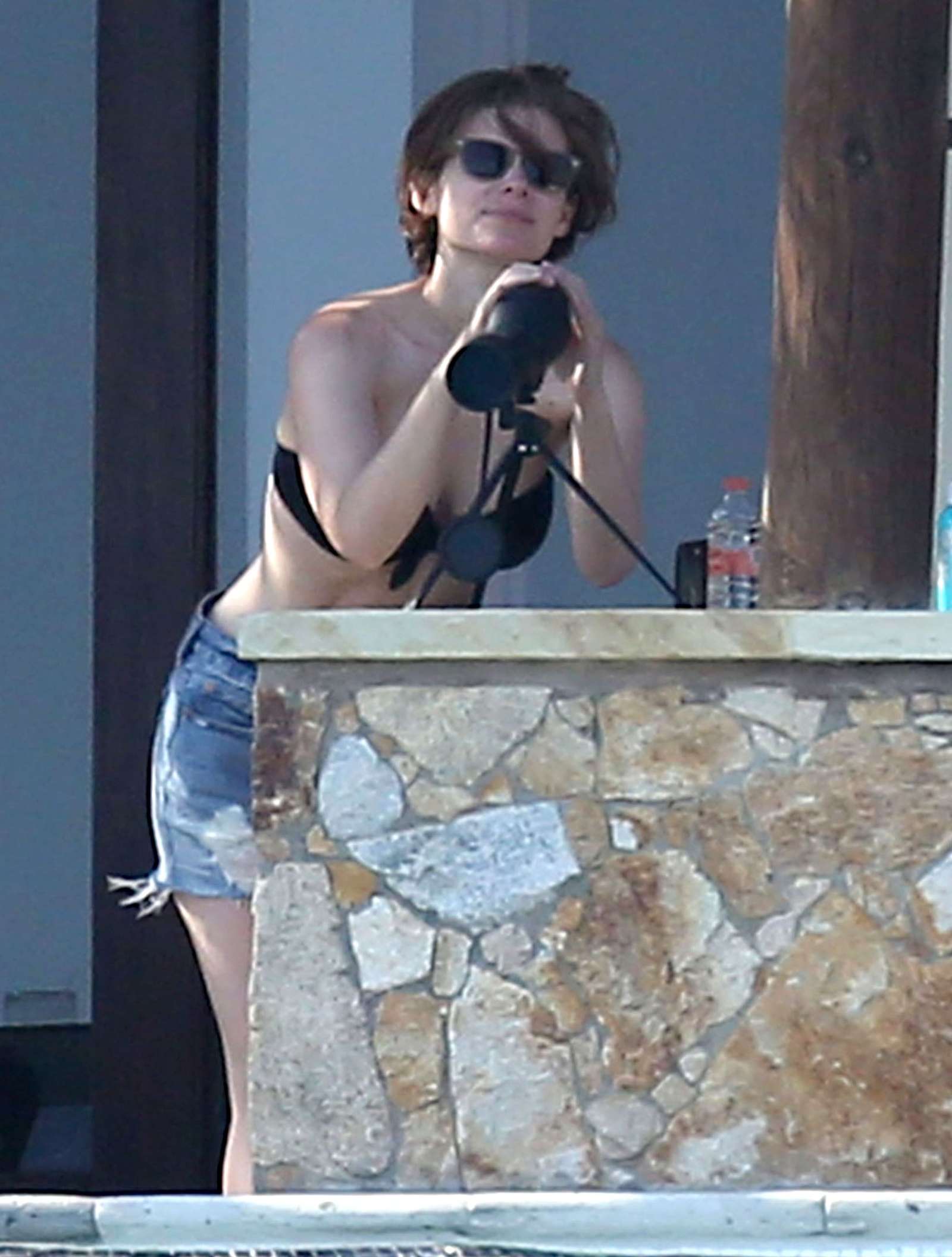 Kate Mara in Black Bikini at a pool in Mexico. 