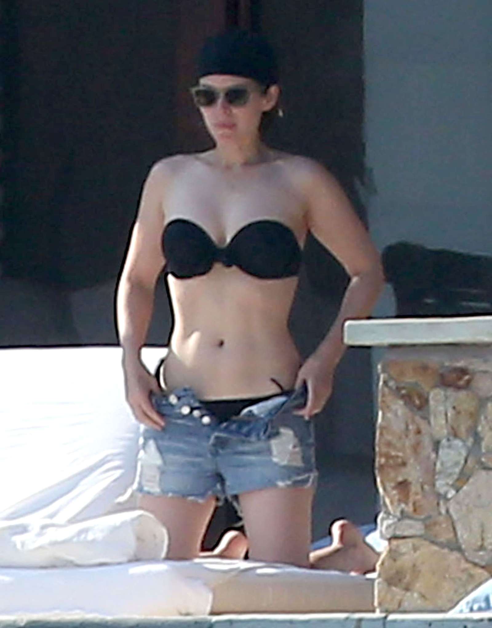 Kate Mara in Black Bikini at a pool in Mexico. 