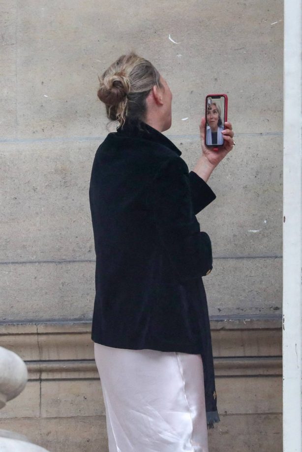 Kate Moss - Chatting on phone while leaving the Fendi fashion show in Paris