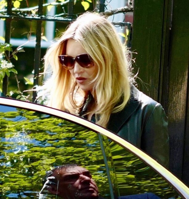 Kate Moss - Out in a long black coat and dark sunglasses in London
