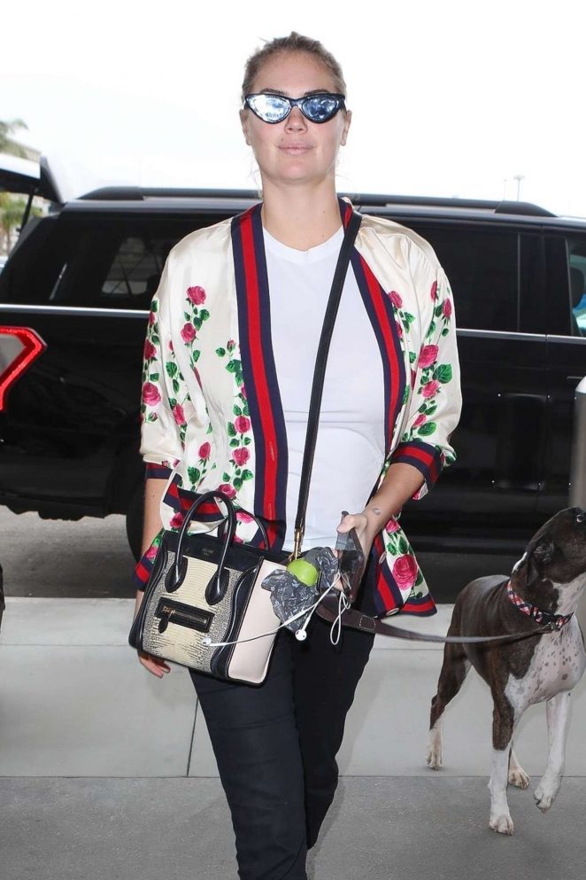 Kate Upton and her dog at LAX Airport in Los Angeles