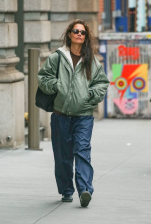 Katie Holmes - In a green olive rain jacket and navy blue rain pants in New York