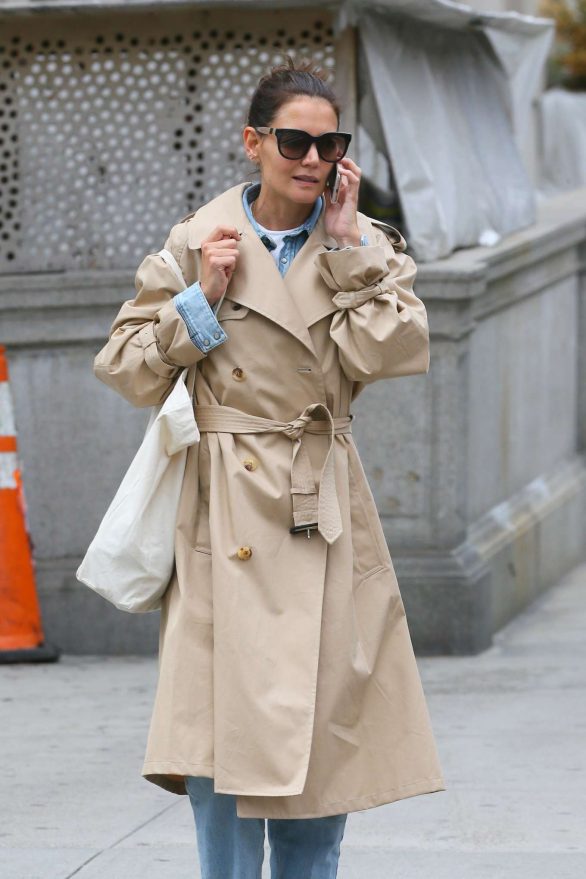Katie Holmes in a trench coat as she takes a phone call out in New York City