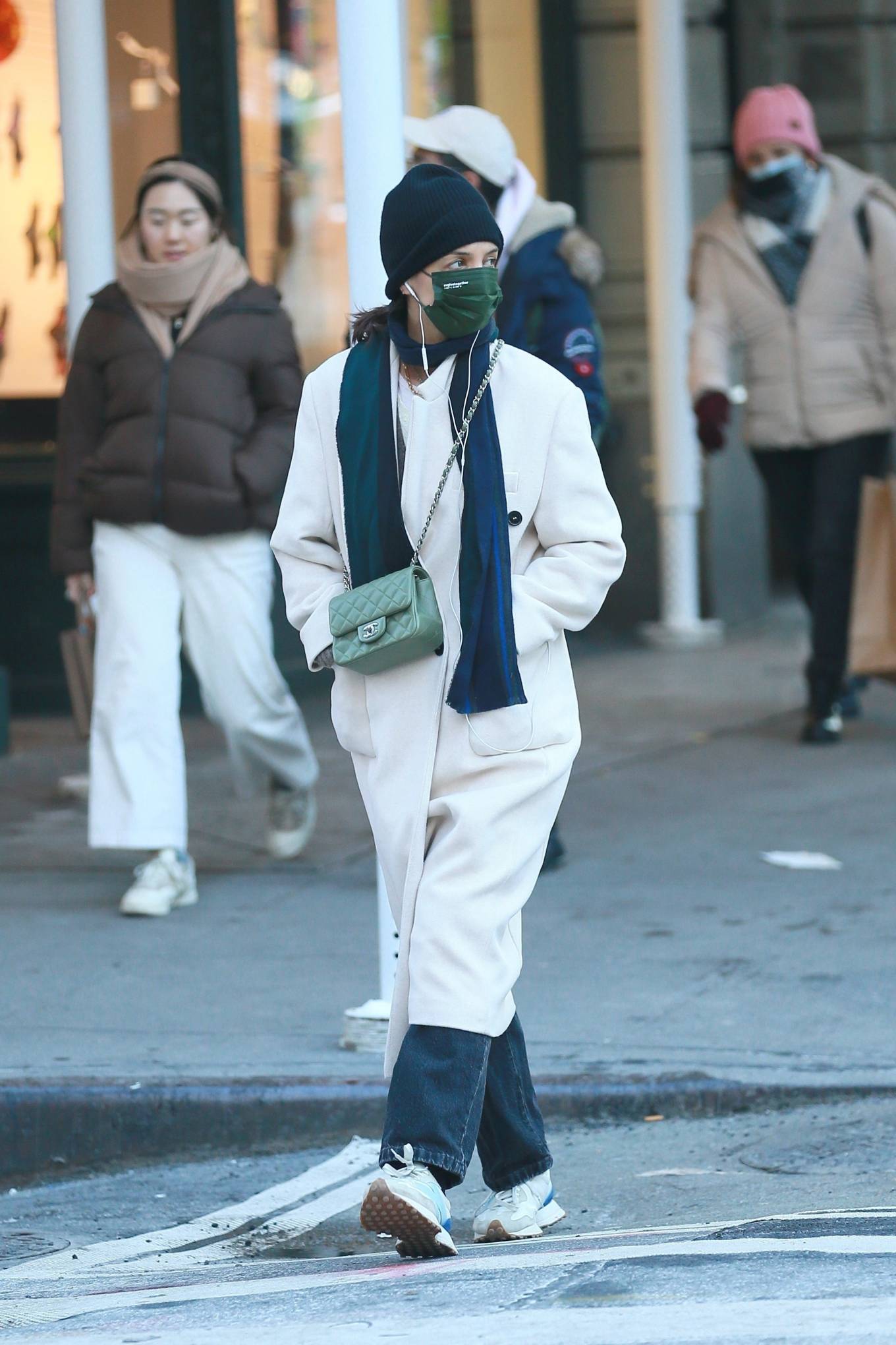 Katie Holmes - In an ivory coat during a stroll in New York